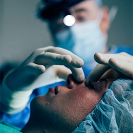 Dr Boris M Ackerman MD performing CO2 laser treatment on patient's face in clinical setting - Rhinoplasty in Newport Beach, CA
